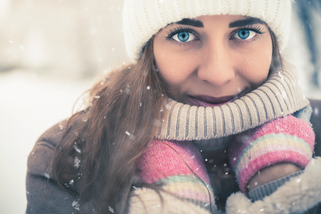 Beautiful woman at cold snowy winter walking at New Yorkの写真素材