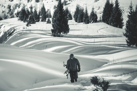 Backcountry adventure to winter Alps, Snowboarder walksの写真素材