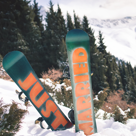 Wedding snowboards at mountain. Wedding ceremony at alpsの写真素材