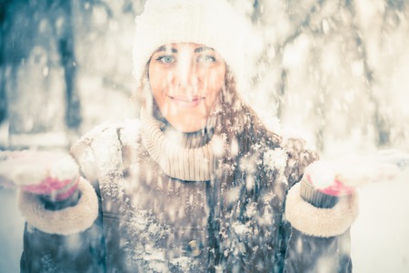 Happy woman at cold snowy winter at New York Parkの写真素材