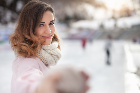 Image of girl ice skating at ice rink, outdoorの写真素材