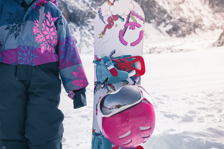 Your happy kid has ski or snowboard lesson at alpine schoolの写真素材