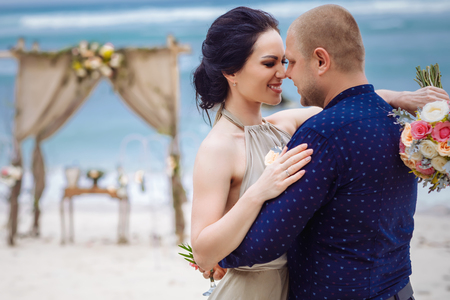 Beautiful couple near the ocean, honeymoon romantic coupleの写真素材