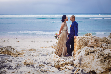 Beautiful couple near the ocean, honeymoon romantic coupleの写真素材