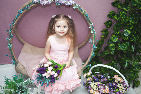 happy womens day for my mom, little girl holds flowers tulipの写真素材
