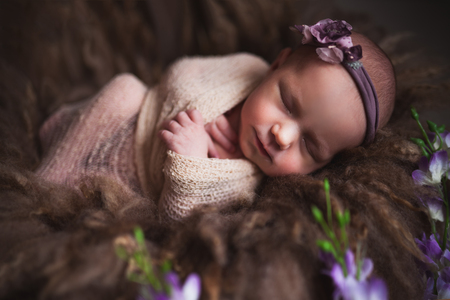 Infant baby girl sleeping at background. Newborn and mothercare conceptの写真素材