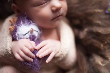 Closeup Infant baby girl sleeping at background. Newborn and mothercare conceptの写真素材