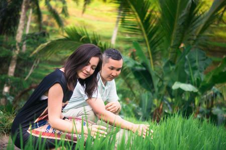 Happy couple traveling at Bali, rice terraces of Tegalalang, Ubudの写真素材