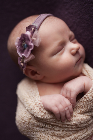 Closeup infant baby girl sleeping at background. Newborn and mothercare conceptの写真素材
