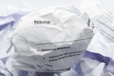 Resume crumpled up and thrown away in the trash concept