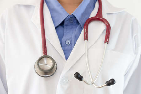 Close up of doctor coat with shirt and stethoscope.