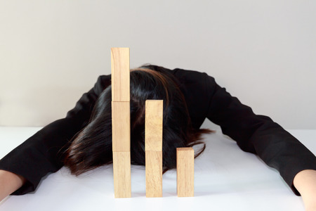 Stressed businesswoman with simulate stock market took a nosedive.の写真素材