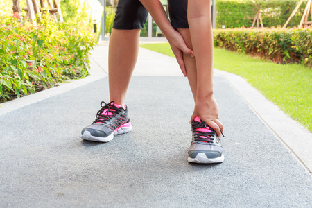 Ankle sprain while jogging or running.の写真素材