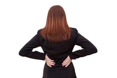 Woman lower back painful injury. Businesswoman backache and injury isolated on white background - office syndrome conceptの写真素材