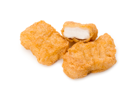 Fried chicken nuggets isolated on white backgroundの写真素材