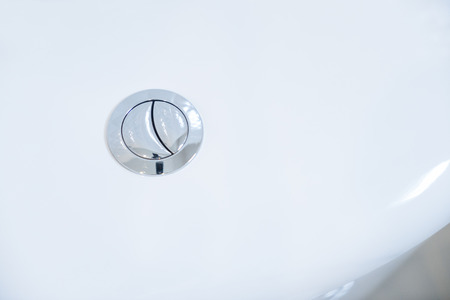 Close up of flush toilet button.の写真素材