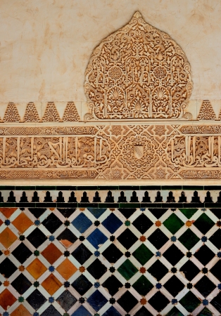 A view of decorative ceramic artwork found on a wall at the Alhambra castle in Granada, Spain. Suitable for an abstract background.の写真素材