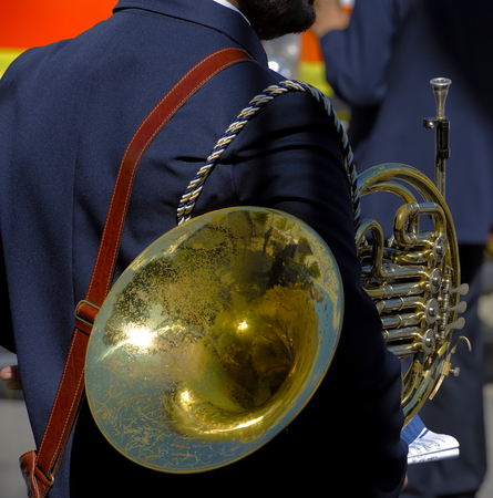 musician with his woodwind musical instrument (horn) during a breakの写真素材