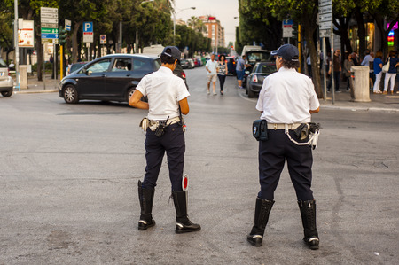 two officers "Municipal Police" officers monitor the smooth running of the city trafficのeditorial素材