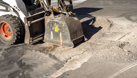 Milling of asphalt for road reconstruction accessory for skid steer