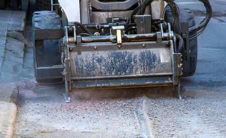 Milling of asphalt for road reconstruction accessory for skid steer