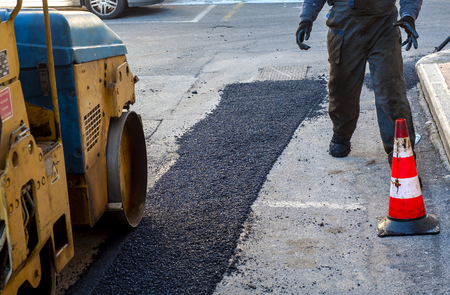 Heavy Vibration roller compactor at asphalt pavement works for road repairingの写真素材