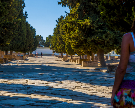 Ancient Roman road in Italica. Tourist on street in the Roman ruins of Italica. Santiponce. Sevilla. Spain.の写真素材