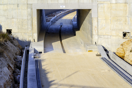 Underpass and tunnel for the construction of a new railway line. Detail of sewage and metal lattice ducts for the electrification of the railway line.の写真素材
