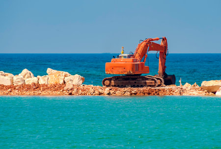 construction equipment on the shore, the construction of breakwaters, coastal protection measures