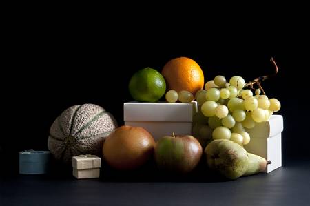 mixed fruit still life art on a black backgroundの写真素材