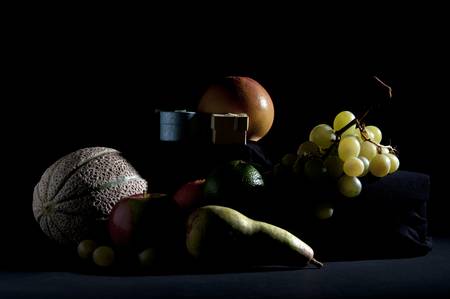 mixed fruit still life art on a black backgroundの写真素材