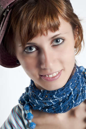 Girl with hat and necklace blue on white backgroundの写真素材