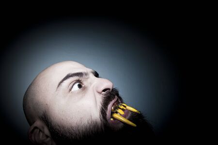 monstrous man with long teeth horror