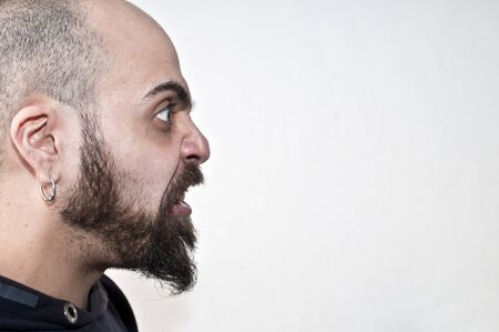 man who grimaces on white backgroundの写真素材