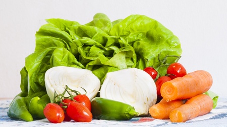 vegetables on the table, lettuce, onions, carrots and tomatoesの写真素材