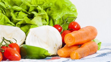 vegetables on the table, lettuce, onions, carrots and tomatoesの写真素材