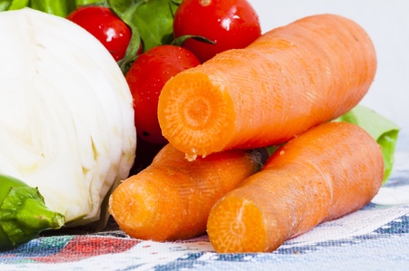 vegetables on the table, lettuce, onions, carrots and tomatoesの写真素材
