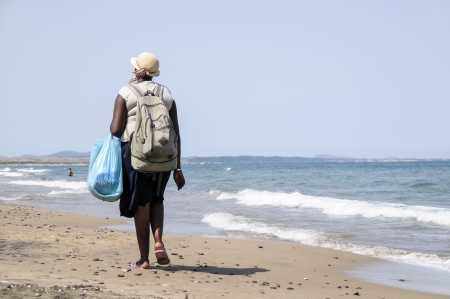 peddlers on the beach walkingの写真素材