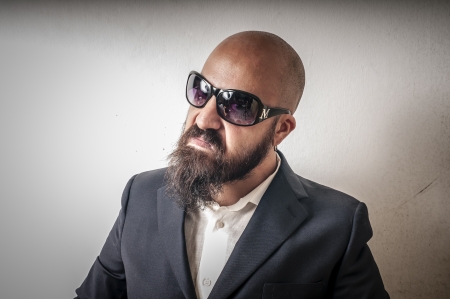 bouncer with jacket and sunglasses on white backgroundの写真素材