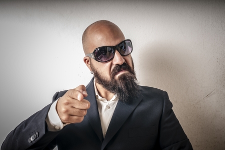 bouncer with jacket and sunglasses on white backgroundの写真素材