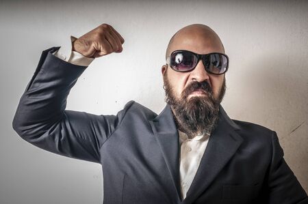 bouncer with jacket and sunglasses on white background