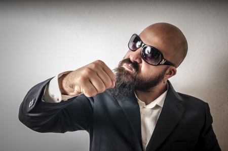 bouncer with jacket and sunglasses on white backgroundの写真素材