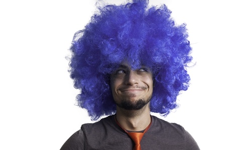 Crazy guy with blue wig on white backgroundの写真素材