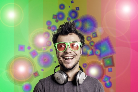 Crazy guy with headphones on colorful backgroundの写真素材