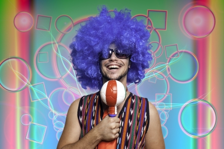 Crazy guy with blue wig on colorful backgroundの写真素材
