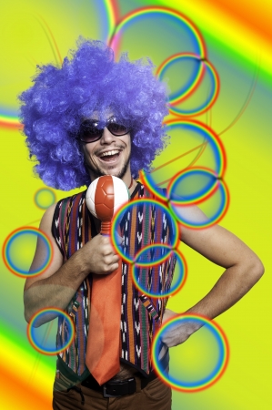 Crazy guy with blue wig on colorful backgroundの写真素材