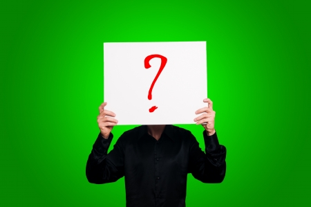 doubt question mark on green backgroundの写真素材
