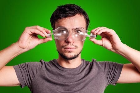 guy with bulbs on green background