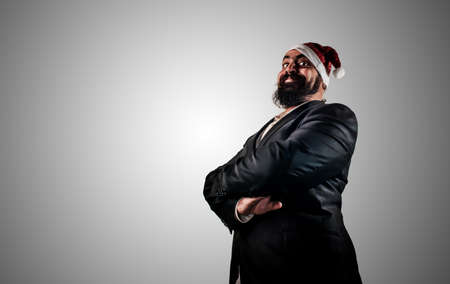 happy modern elegant santa claus babbo natale on grey backgroundの写真素材