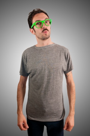 guy with green eyeglasses and mustache on green backgroundの写真素材